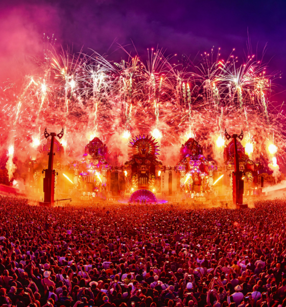 Defqon.1 main stage at night with fireworks above a large crowd, following the 2026 cancellation due to extreme heat warnings in the Netherlands.