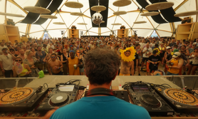 Floating Points performing inside the Sunflower Sound System with custom speaker stacks surrounding the audience