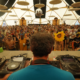 Floating Points performing inside the Sunflower Sound System with custom speaker stacks surrounding the audience
