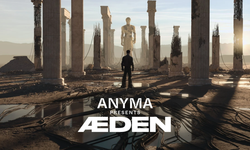Anyma presents ÆDEN artwork showing a futuristic ruined landscape with towering columns, a central statue and the ÆDEN logo in the foreground