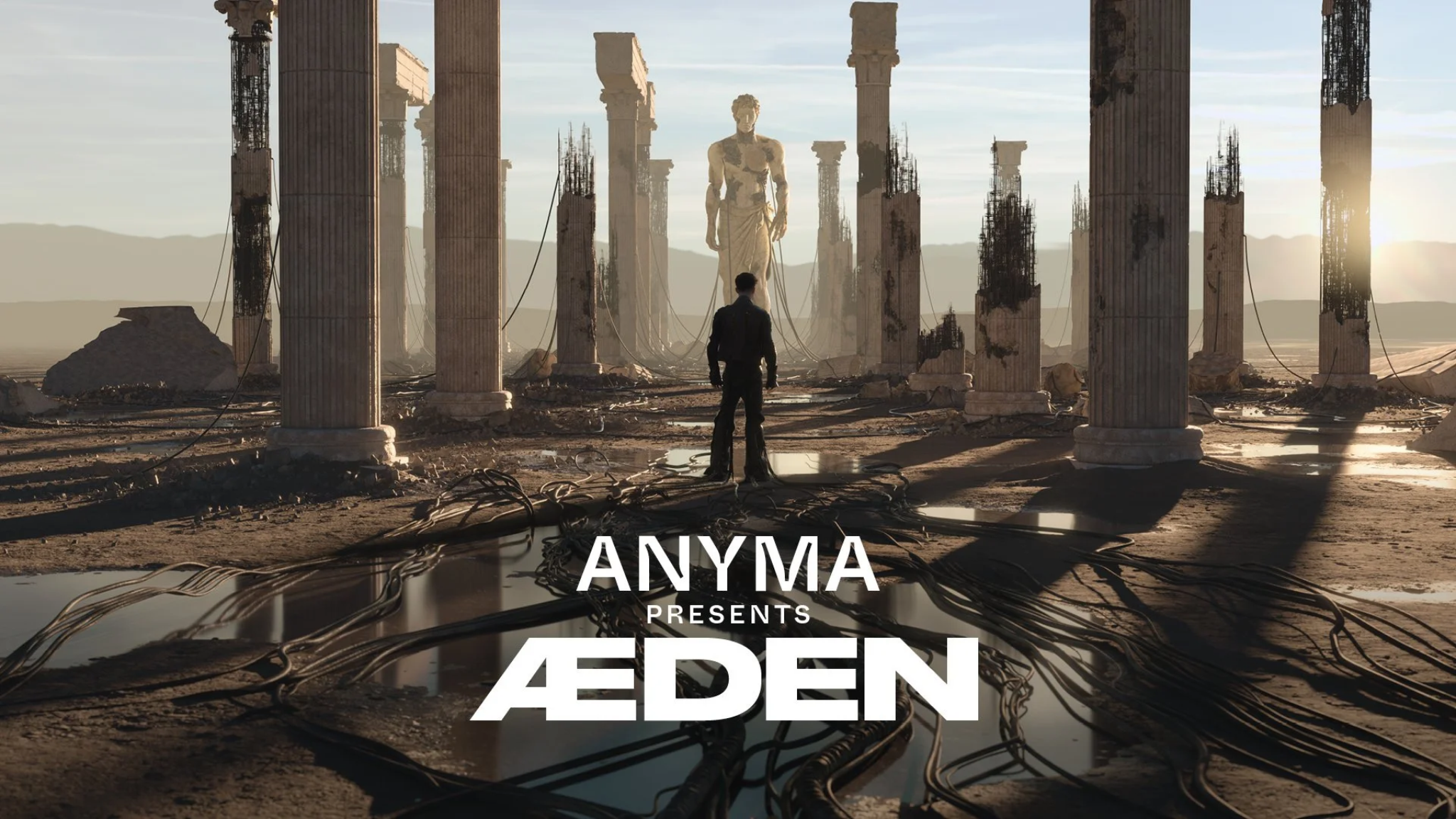 Anyma presents ÆDEN artwork showing a futuristic ruined landscape with towering columns, a central statue and the ÆDEN logo in the foreground