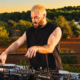 James Hype performing on several Pioneer DJ decks during an outdoor set