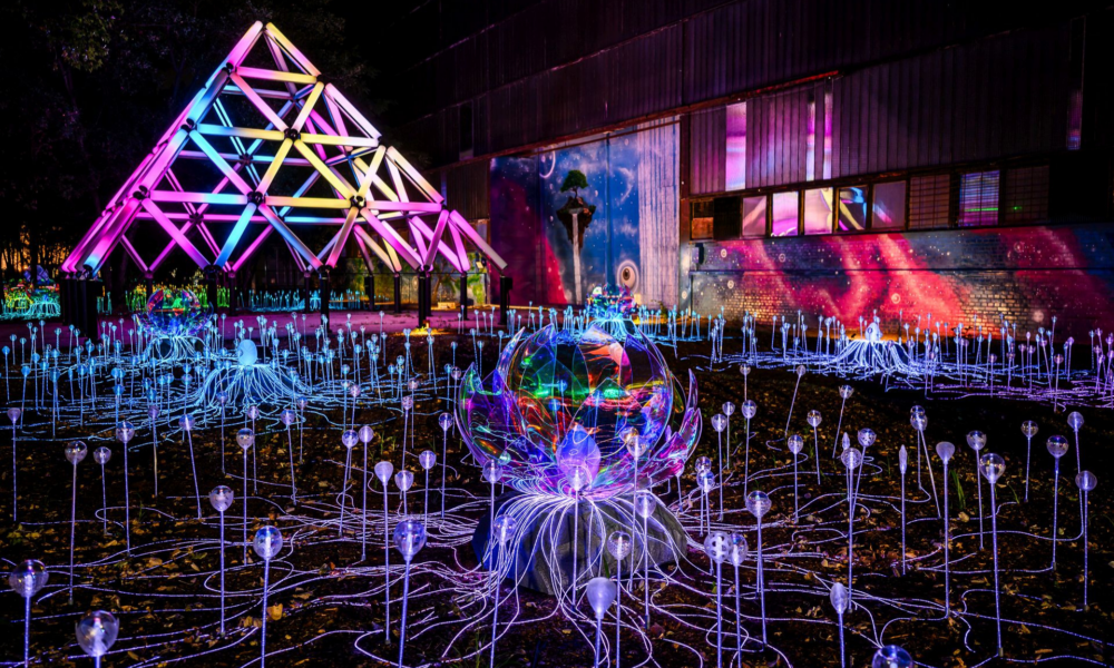 Illuminated installations at Aura Bay Light Park in Budapest, with a multicoloured pyramid and glowing botanical displays on Óbudai Island.