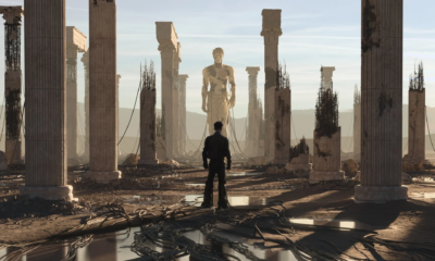 Anyma ÆDEN visual featuring a lone figure surrounded by ruined classical columns, exposed structures and a large statue in the distance.
