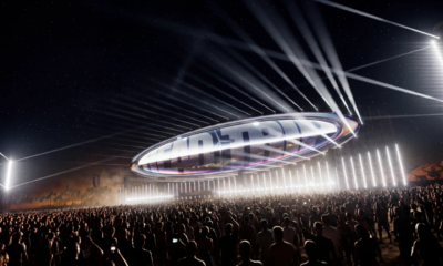 Head Trip stage concept at Empire Polo Club with a large suspended oval structure, bright white beams and a crowd below