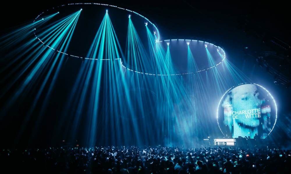 Charlotte de Witte playing at 808 Festival beneath blue stage lighting in front of a large crowd