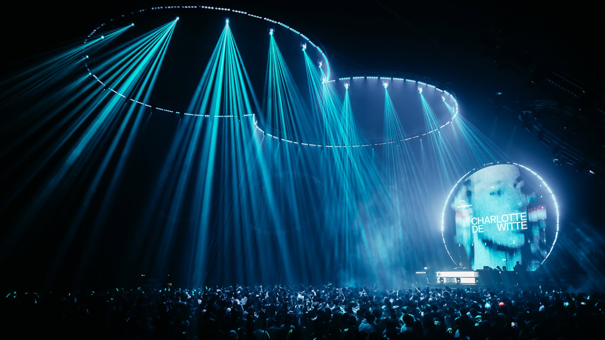 Charlotte de Witte playing at 808 Festival beneath blue stage lighting in front of a large crowd