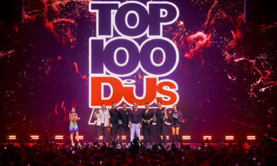 Top 100 DJs Awards ceremony on stage at [UNVRS] in Ibiza with several artists holding awards in front of the crowd