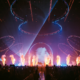 808 Festival stage at BITEC Bangna with circular lighting rigs, lasers, smoke effects and a large crowd