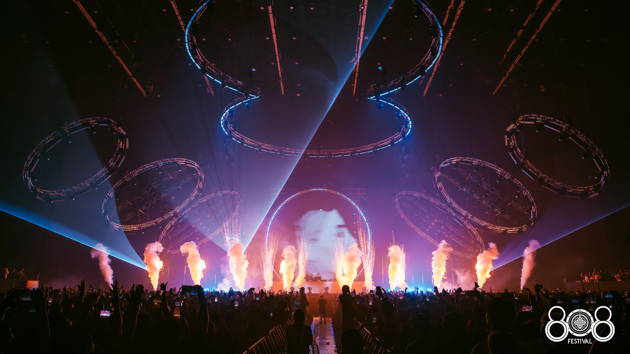 808 Festival stage at BITEC Bangna with circular lighting rigs, lasers, smoke effects and a large crowd