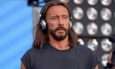 Bob Sinclair wearing silver headphones during a live performance