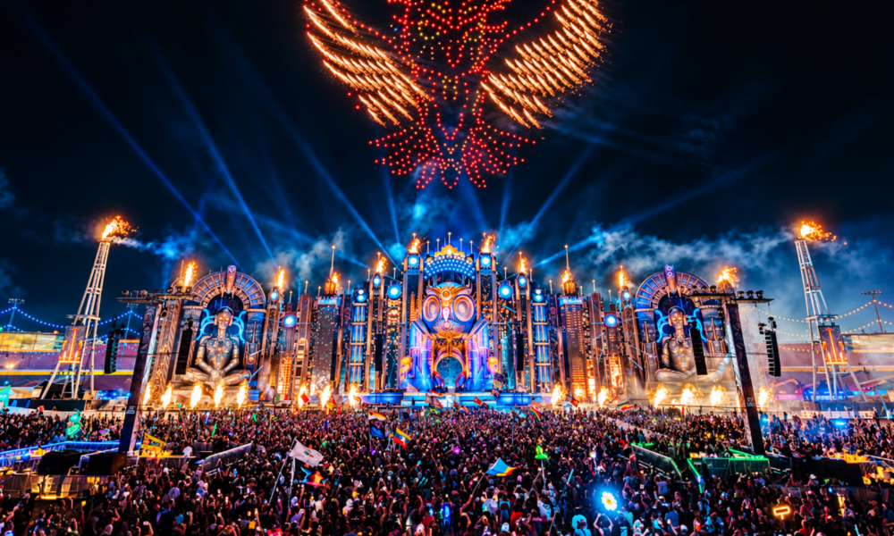 EDC Las Vegas stage lit up at night with fireworks above a large crowd