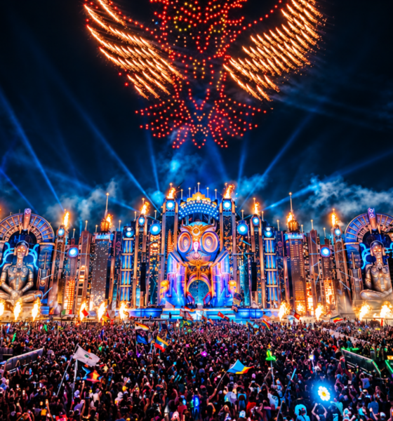 EDC Las Vegas stage lit up at night with fireworks above a large crowd
