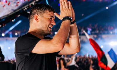 Martin Garrix clapping onstage during a live festival performance