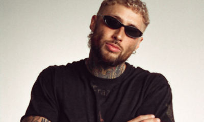 Lance Savali wearing black sunglasses and a black shirt in a promotional portrait for ‘All I See’