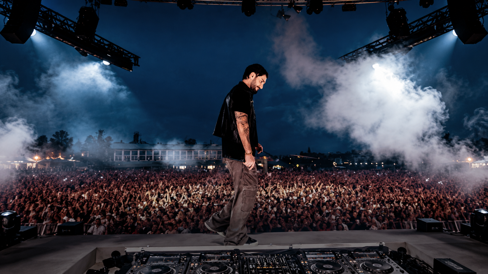 Alesso performing on stage in front of a large crowd, featured in New EDM Friday Oct 16