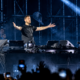 Calvin Harris performing on stage during a festival set for the 12th anniversary of Motion