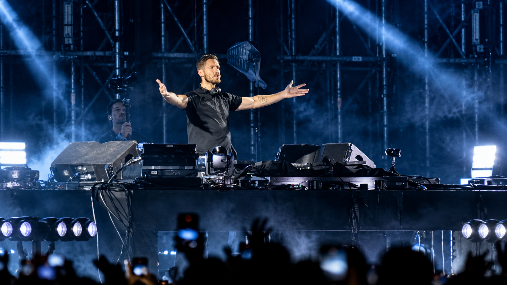 Calvin Harris performing on stage during a festival set for the 12th anniversary of Motion