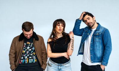 Dev and The Cataracs posing together in a promotional photo
