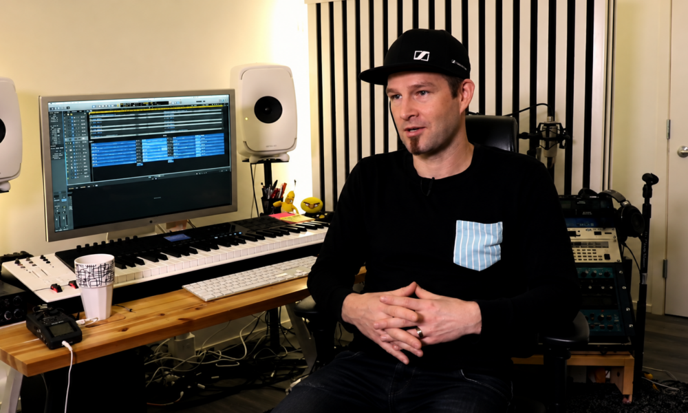 Darude sitting inside his music studio for the 27th anniversary of Sandstorm