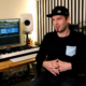 Darude sitting inside his music studio for the 27th anniversary of Sandstorm