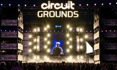 Crowd facing the circuitGROUNDS stage with large LED screens and bright lighting at EDC