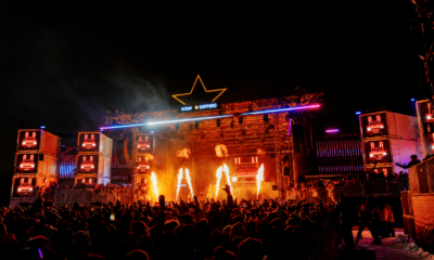 Crowd watching the Sapporo Stage with flames and red lighting during Igloofest at Montréal’s Old Port