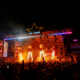 Crowd watching the Sapporo Stage with flames and red lighting during Igloofest at Montréal’s Old Port