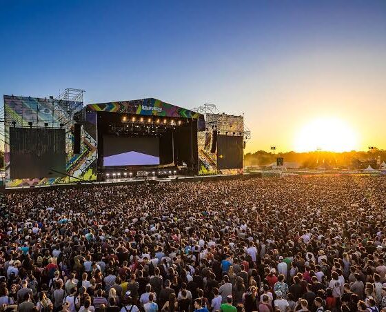 Huge crowd facing the Lollapalooza main stage at sunset