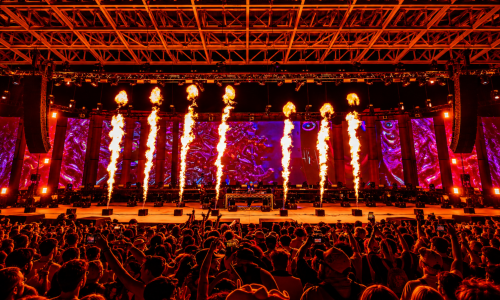 Jackpot Festival stage in Las Vegas with pyrotechnics, LED screens and attendees during the electronic music festival