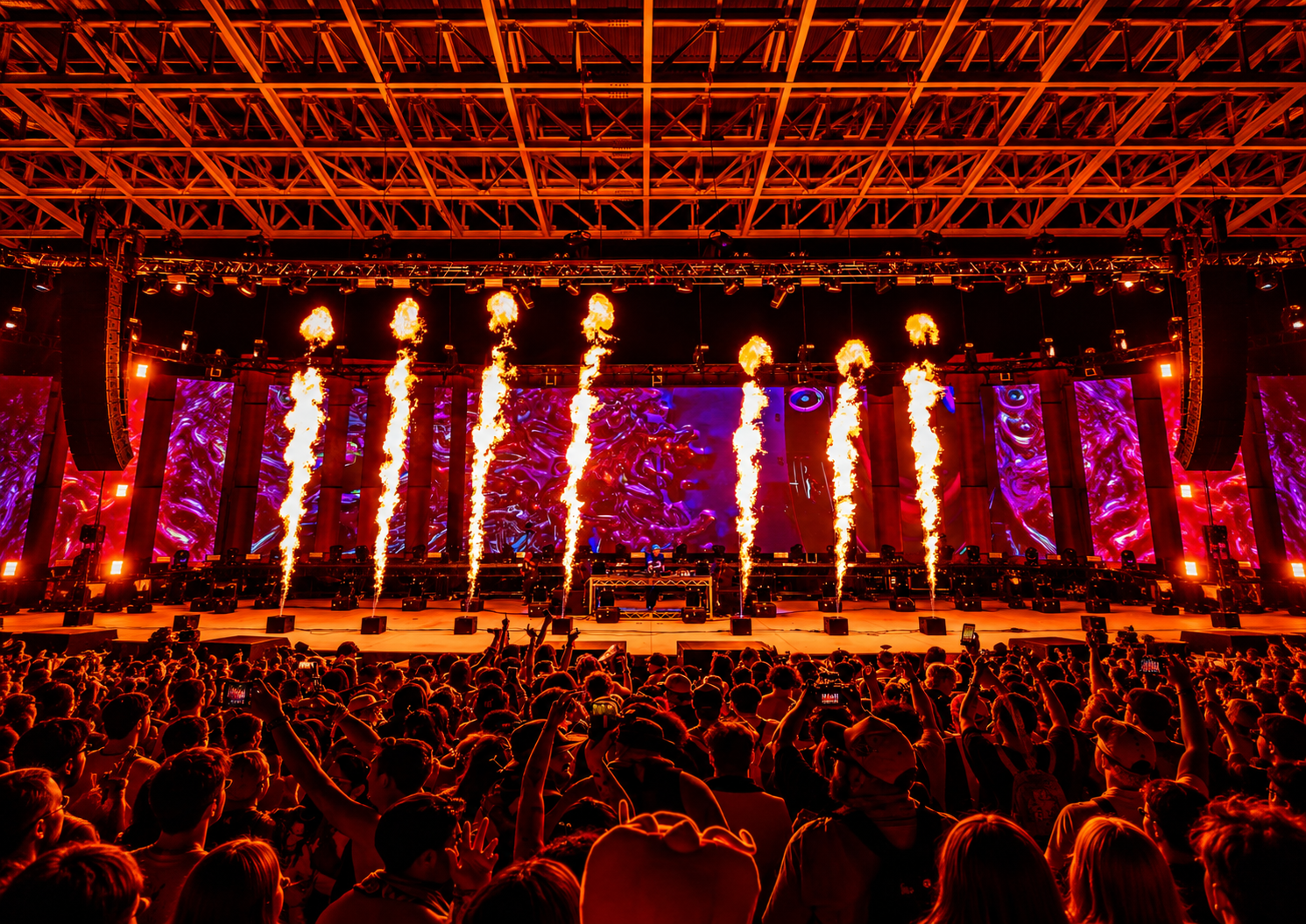 Jackpot Festival stage in Las Vegas with pyrotechnics, LED screens and attendees during the electronic music festival