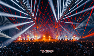 Together Festival stage at BITEC Bang Na with red lasers, white lights, flames and a large crowd