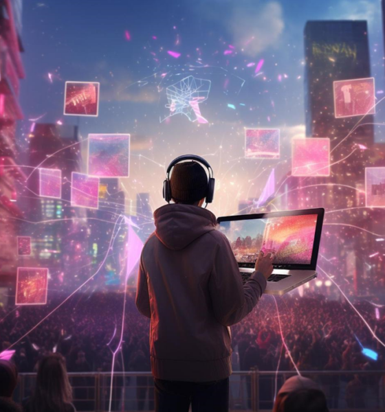 Person in headphones holding a laptop above a crowd, surrounded by floating pink digital screens in a neon city